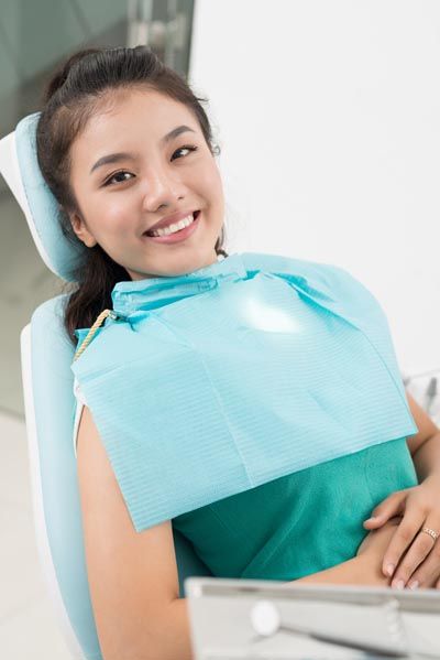 patient smiling during her visit at Evergreen Smile Studio