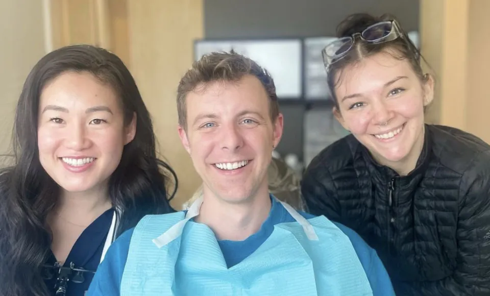 Seattle dentist Dr. Rebekah, DDS smiling with her patients at Evergreen Smile Studio