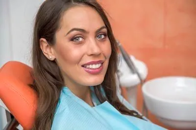 patient smiling after getting her wisdom teeth removed at Evergreen Smile Studio