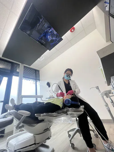 Dr. Rebekah providing a patient with cosmetic dental care at Evergreen Smile Studio