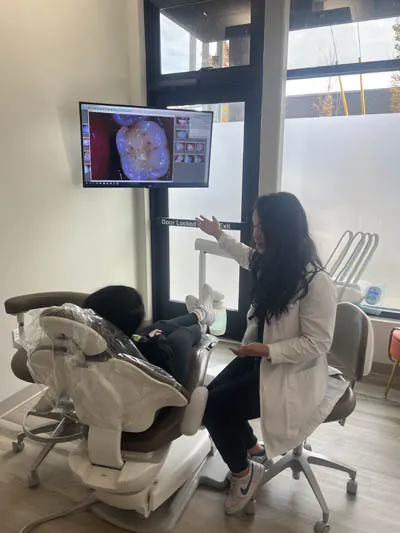 Dr. Rebekah discussing restorative dentistry options with a patient