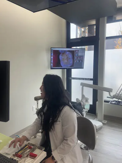 Dr. Rebekah reviewing a patient's dental X-rays