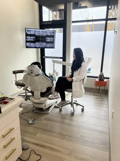 Dr. Rebekah talking with a patient about how to restore their smile