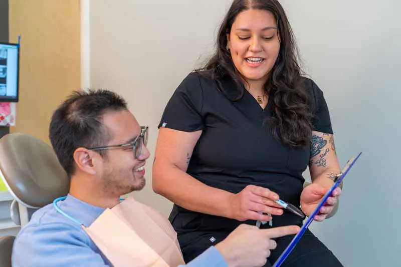 patient discussing oral surgery at Evergreen Smile Studio